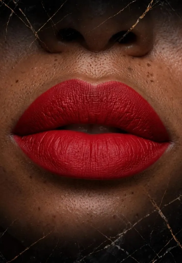 Close-up of lips wearing a bold red lipstick